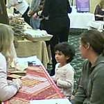 A young sage with a reader at the Holistic Healing Expo