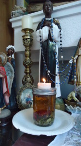 Honey Jar with lit candle on altar